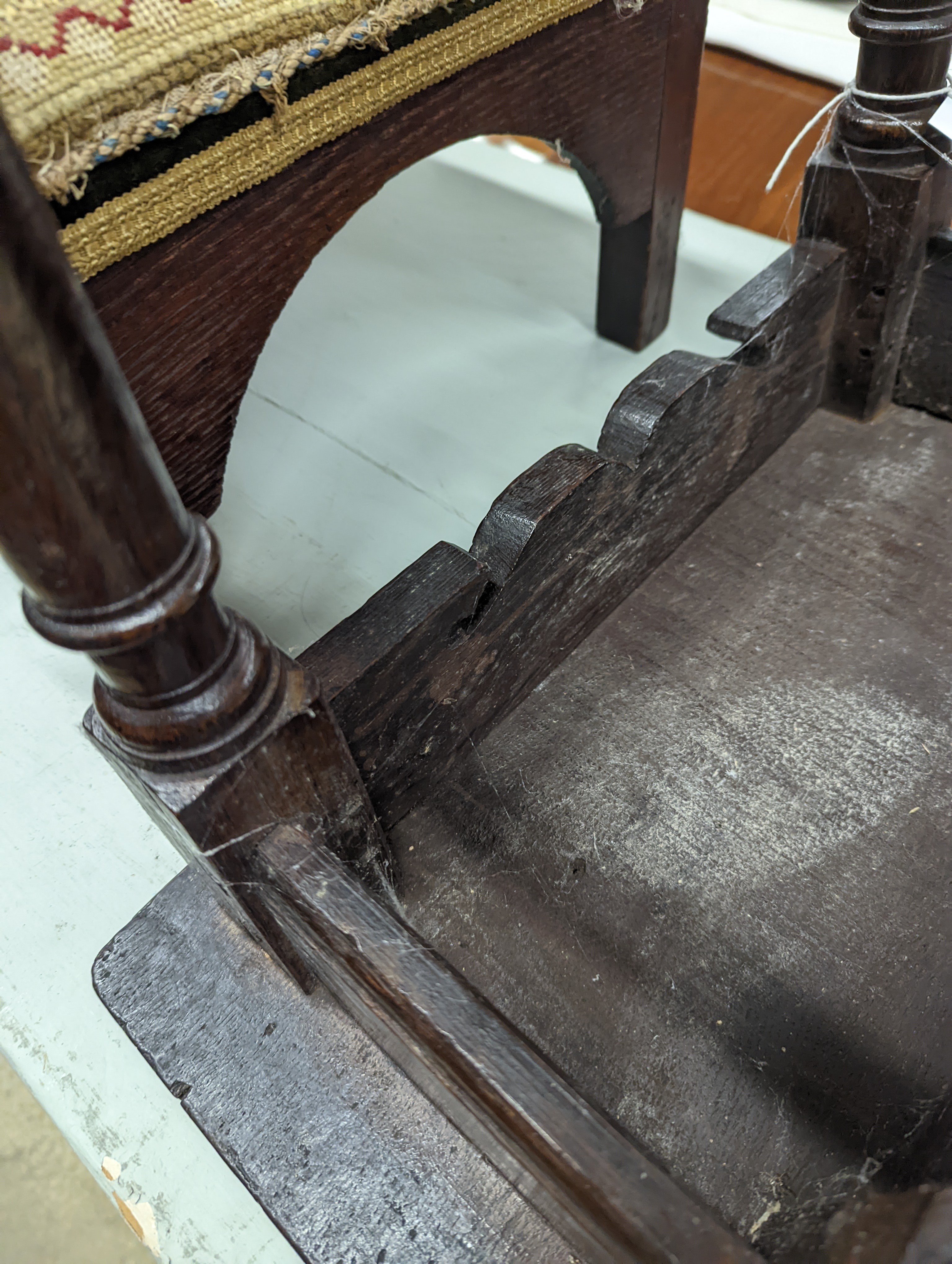 A 17th century style oak joint stool, width 46cm, depth 26cm, height 46cm and a George III stool with Victorian needlework seat, length 33cm